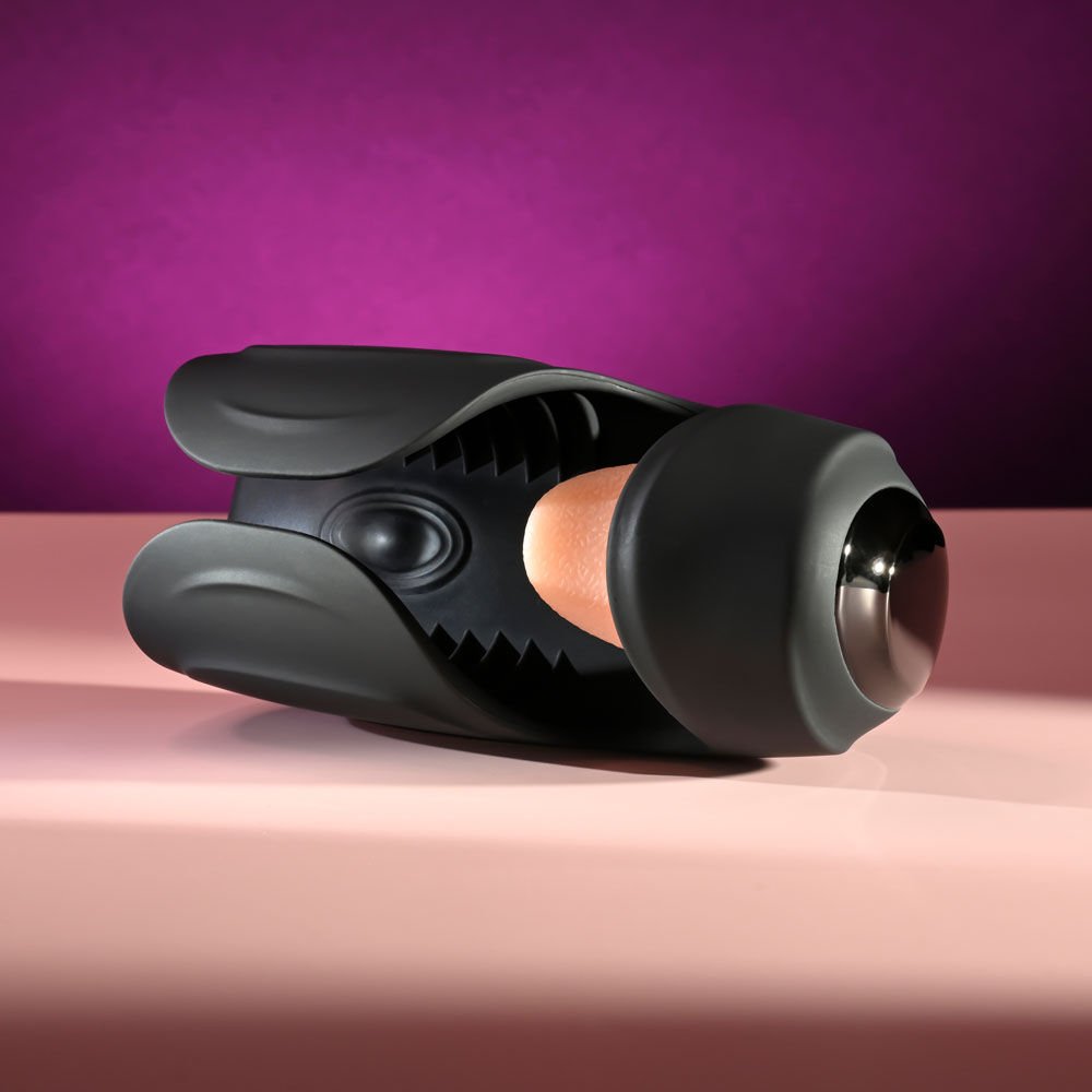 Zero Tolerance Lick the Tip vibrating masturbator lying on the floor, showing the top and tip area of the toy for detail reference, aigaints on a purple and pink background | Flirty Bay adult store Perth